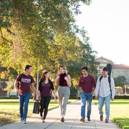 Media card - Graduate students walking together